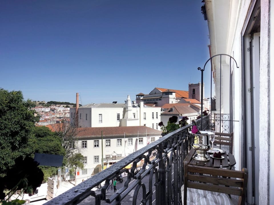 Enjoy breathtaking city views from this delightful balcony, perfectly perched for soaking in sunny skies and vibrant local charm. Relax with a drink and watch the world go by in your private urban retreat.