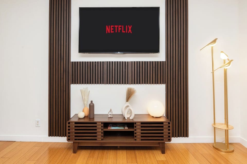 Welcome to our cozy living room, designed for ultimate relaxation and comfort. Sink into our plush sofa, surrounded by stylish decor that exudes warmth and charm. Unwind in front of the flat-screen TV