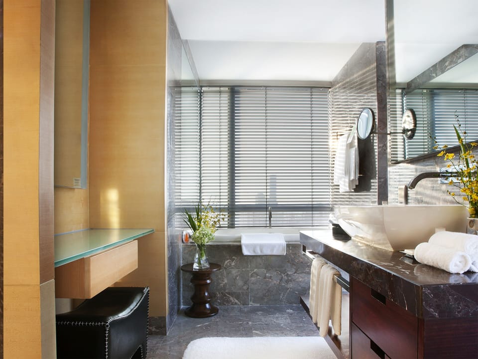 Separate tub and shower, rainfall showerhead, free toiletries