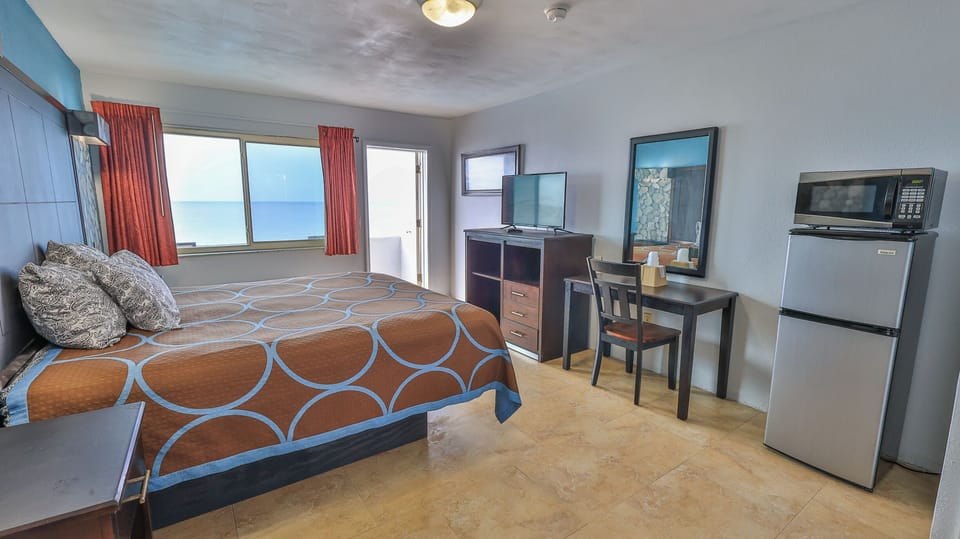 Oceanfront King Bed, Patio or Balcony | Individually decorated, individually furnished, desk, free WiFi