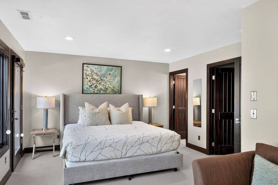 Bedroom 4 features a king bed, TV, and ensuite bathroom for a restful stay.