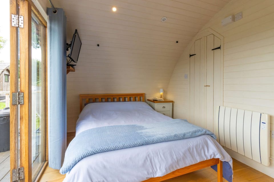 Settle beneath soft bedding for a peaceful night, then open the doors to fresh Welsh air and the calming sights and sounds of the countryside.
