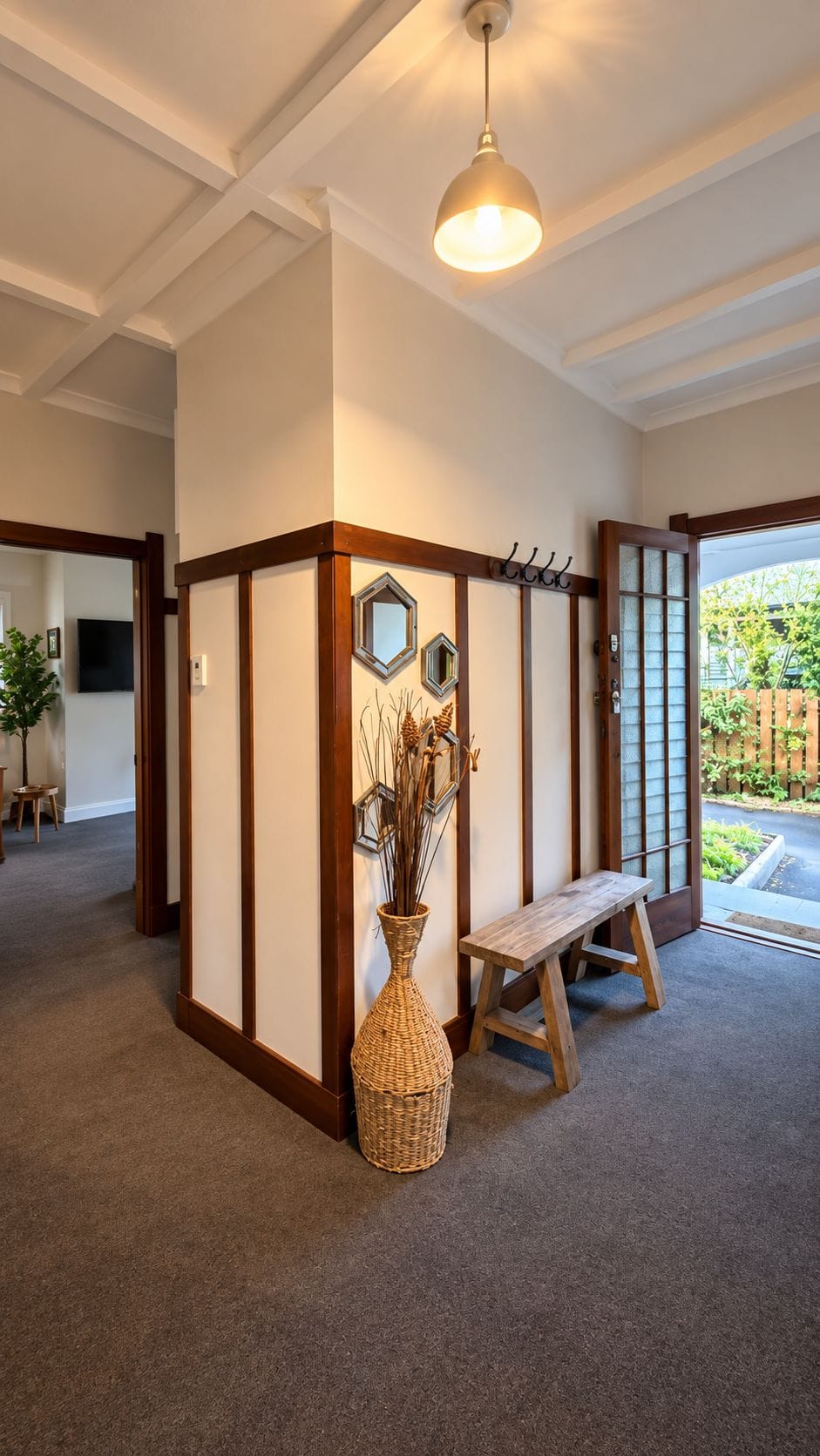 Welcoming entryway with high ceilings, rustic accents, and garden views