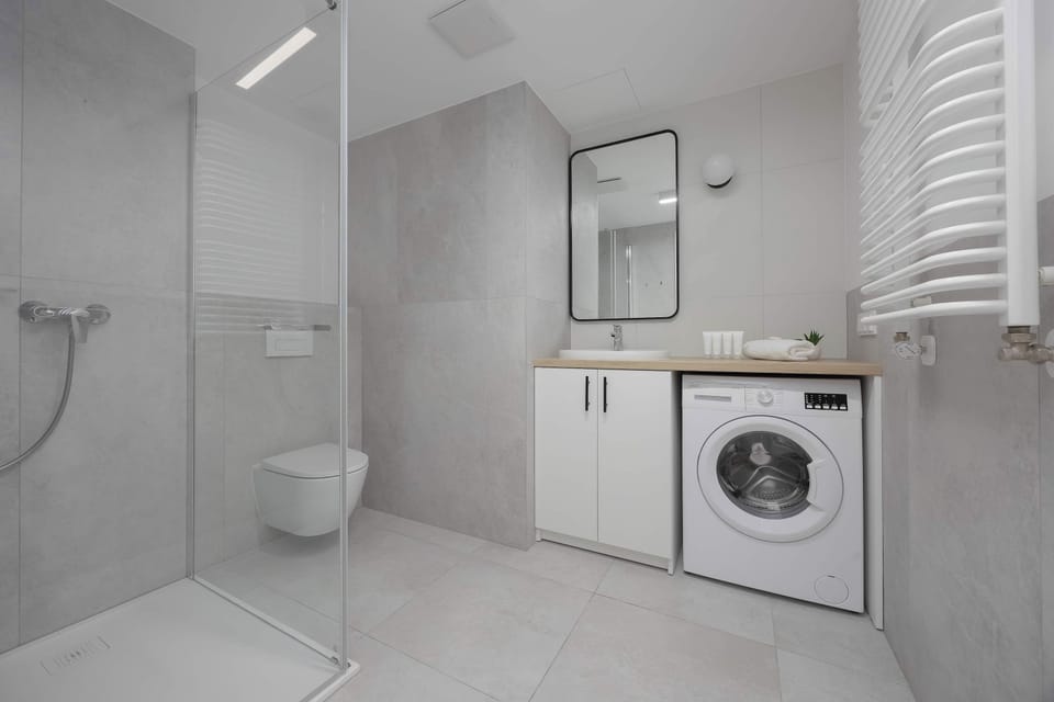 The bathroom offers a clean and functional space for your stay. 