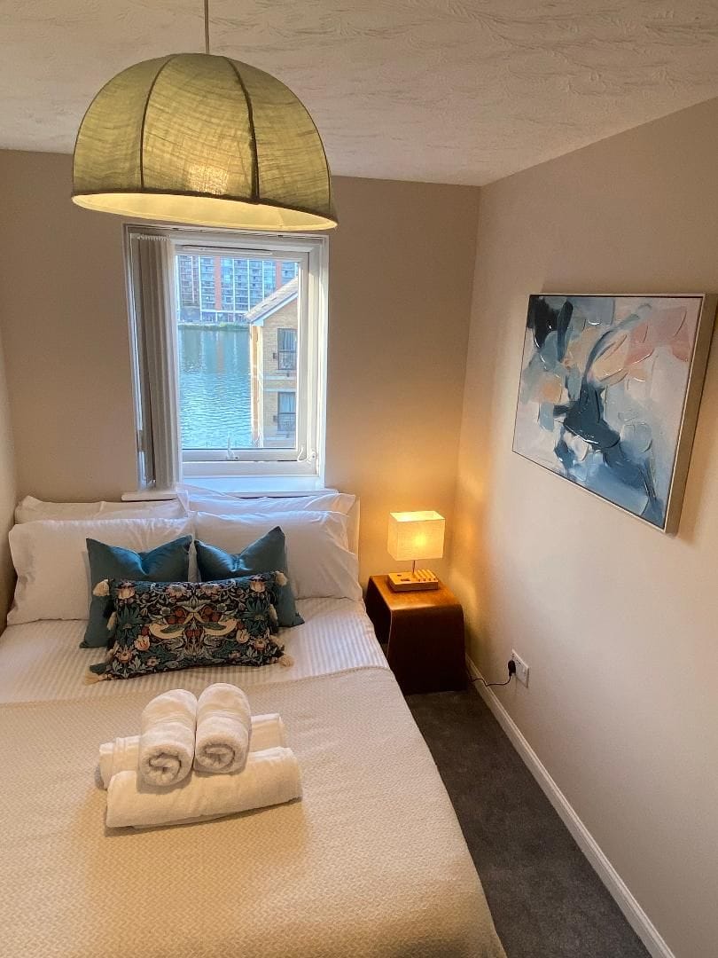 Cozy, guest-ready bedroom with soft lighting and stylish modern touches