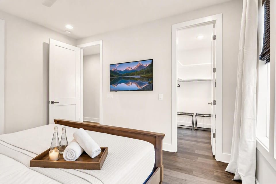Open closet and wall-mounted TV in the bonus room let you unpack and settle in without any claustrophobic rental vibes, book your stay with Misfit Homes