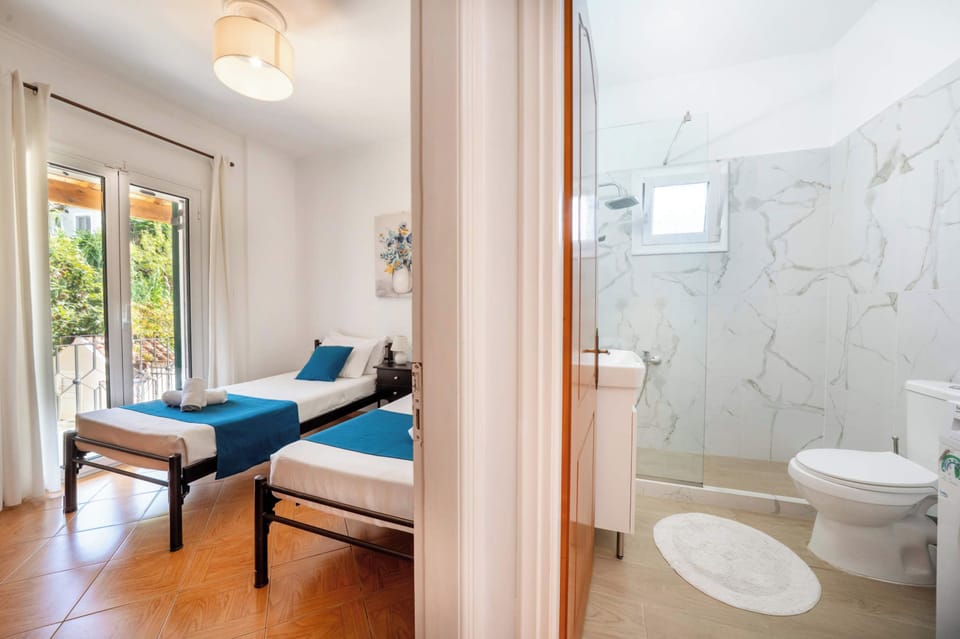 Twin bedroom beside the bathroom