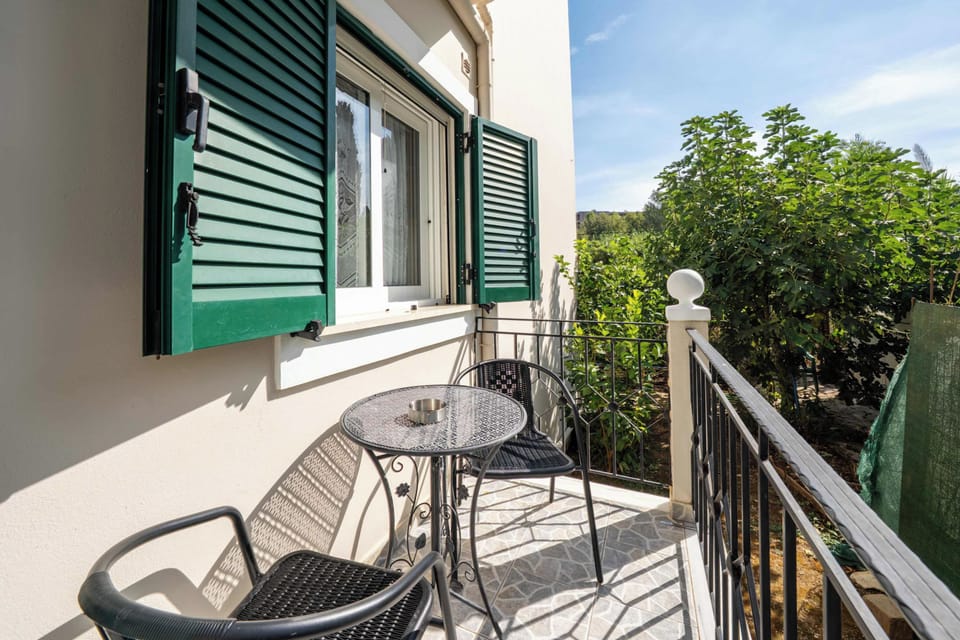 Covered terrace with leafy garden outlook