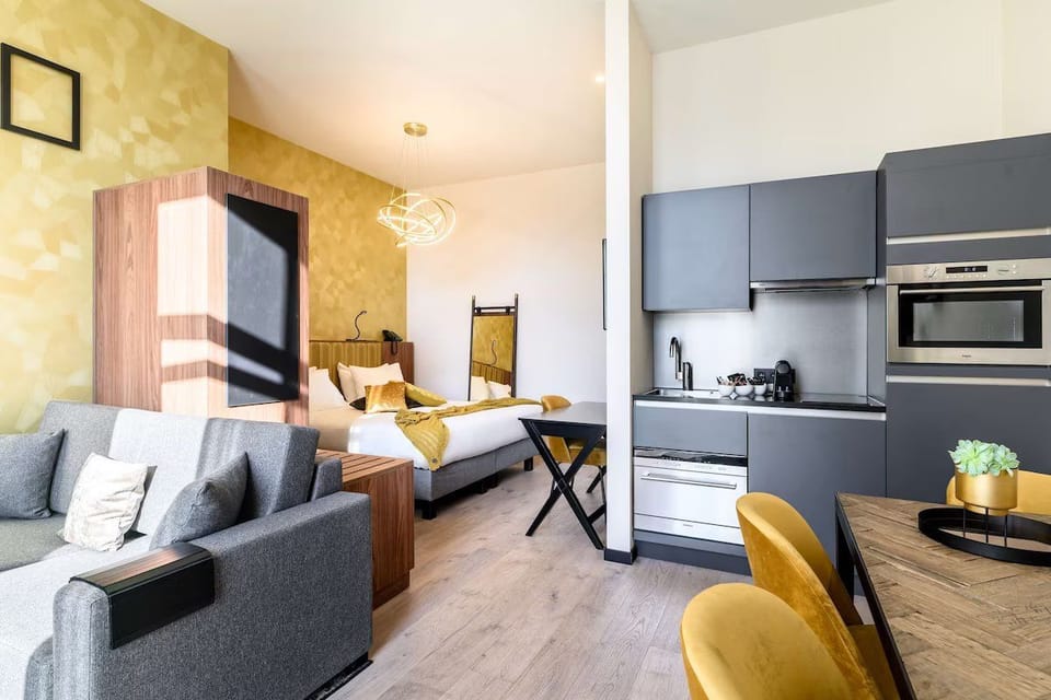 Lounge comfortably in your spacious studio with sofa and kitchenette.