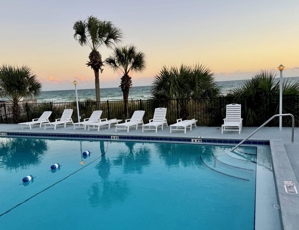 Enjoy a beach sunset from the pool