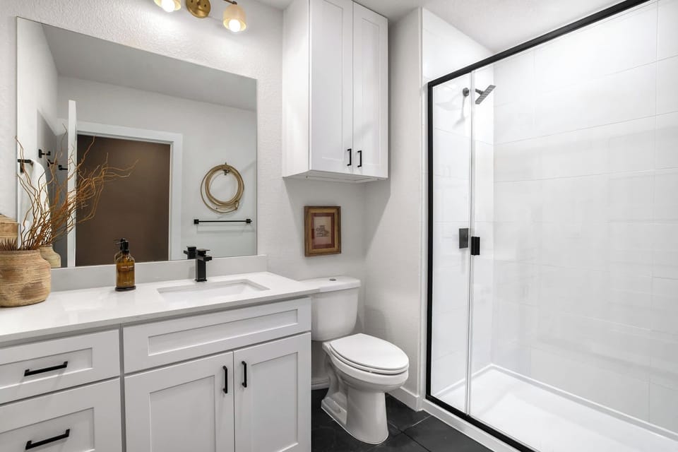 Bright finishes and a sleek walk-in shower make refreshing easy