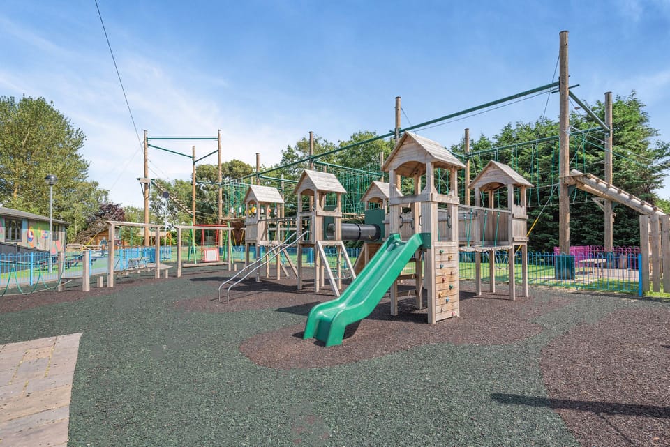 Large family-friendly playground with slides, climbing frames & safe surfacing
