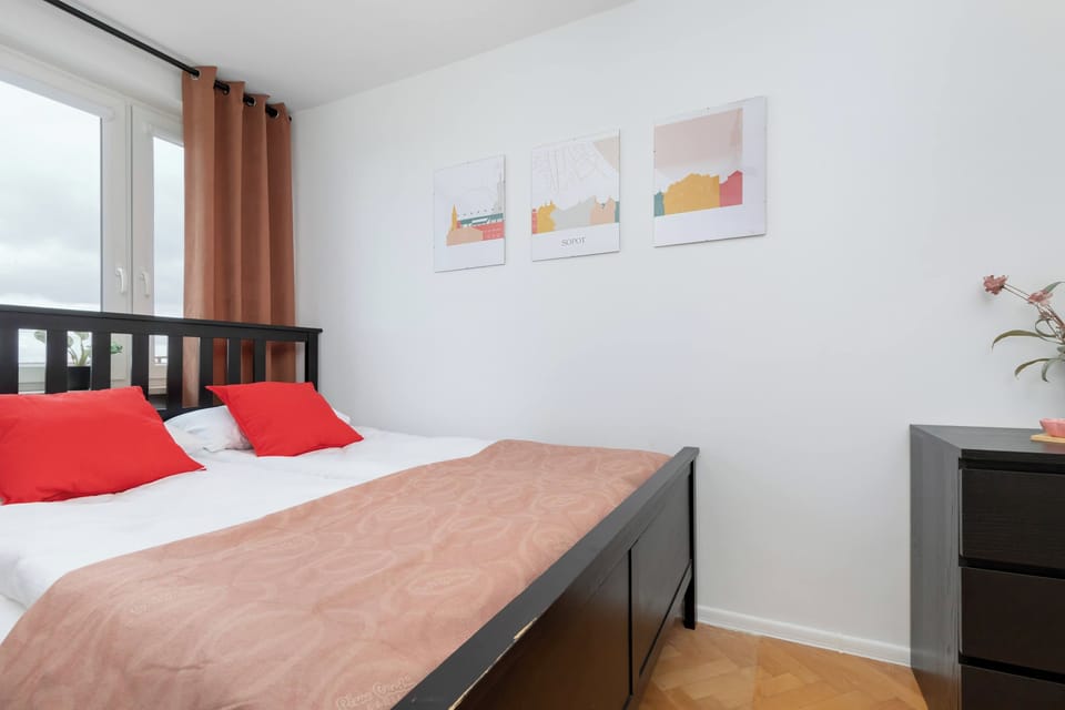 Cozy bedroom with a double bed, bedside tables, and minimalist décor.