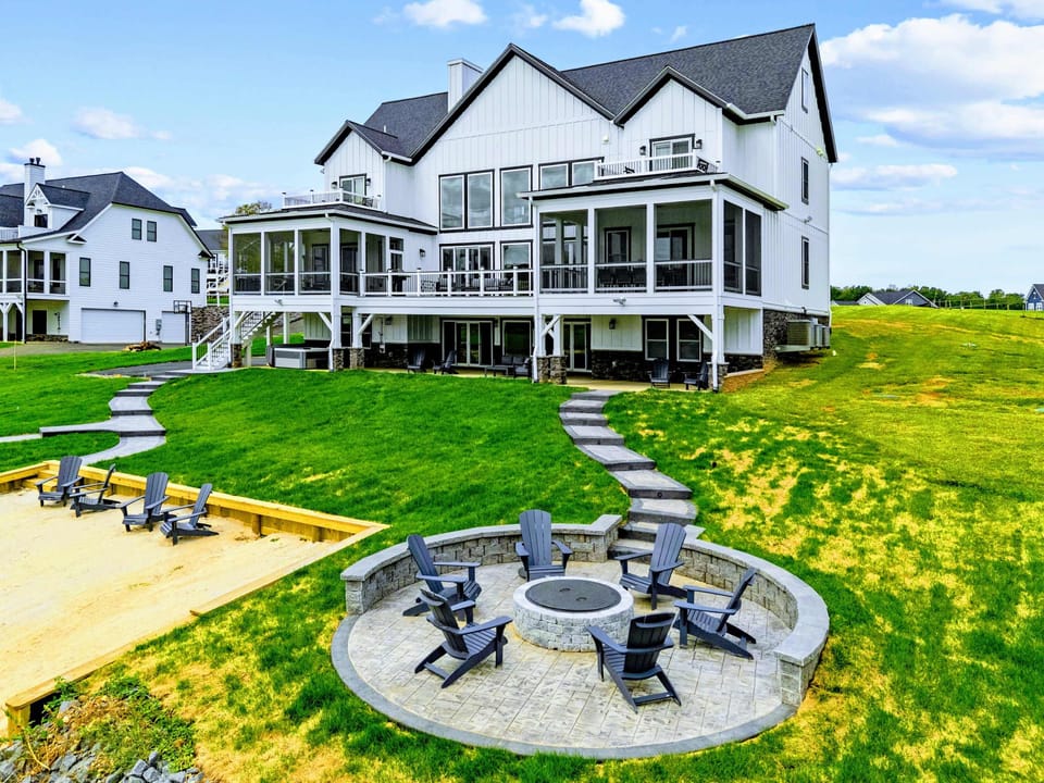 Fire Pit - From above, the paver path winds from the lower patio down to the fire pit circle, with the sand beach alongside.