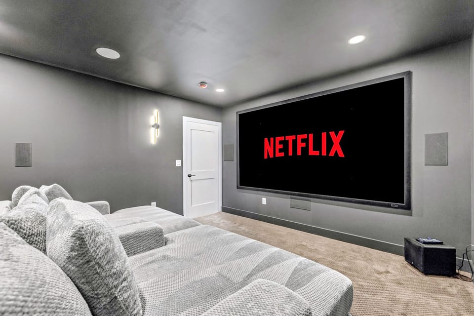 Theater Room - Projector, big screen and tiered lounge seating, the spot for movie night after a day on the water.