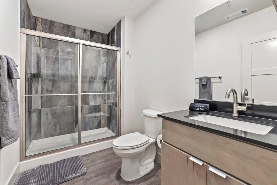 Full bathroom with a glass walk-in shower