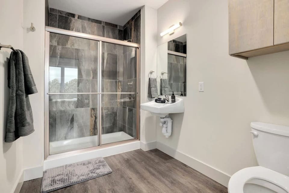 En suite bathroom with a glass walk-in shower