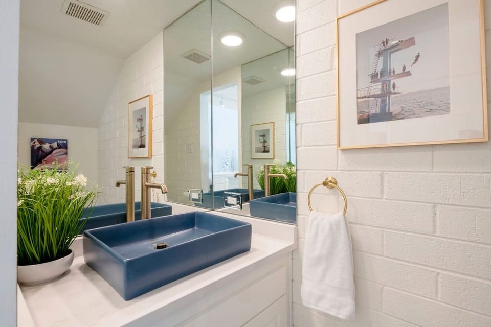 Even the details impress at Park Avenue 299. The main level half bathroom features a bold navy vessel sink, gold fixtures, and crisp white tile — a stylish touch that sets this Park City vacation rental apart from the rest.