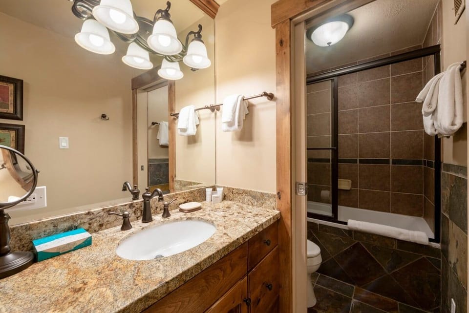 No detail was overlooked at Resort Plaza 5002 — this well-finished bathroom with granite vanity and elegant fixtures makes this Park City condo rental a cut above the rest for a truly comfortable mountain stay.