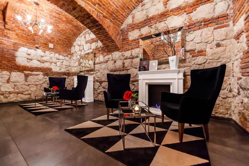 Linger beneath historic arches in a cozy conversation nook.