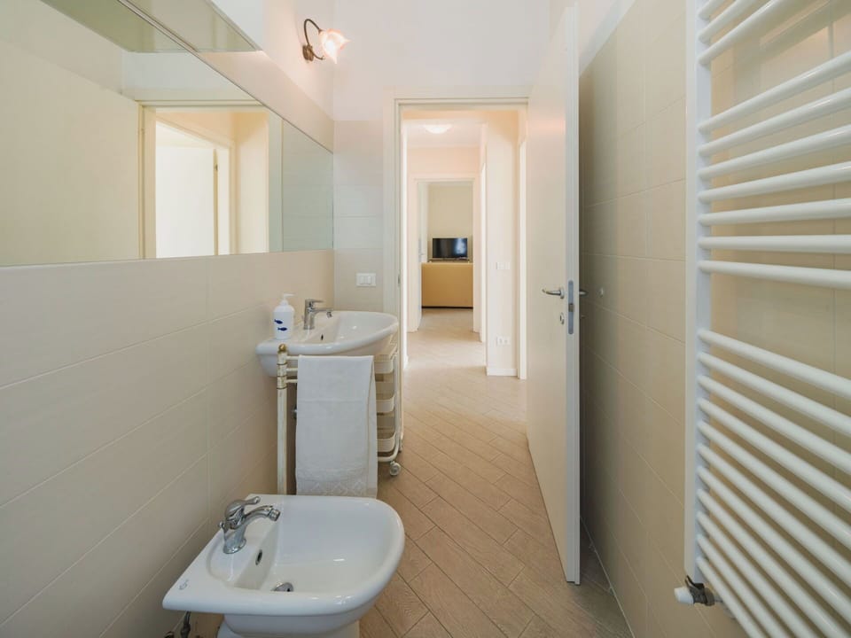 Flooring, Floor, Interior Design, Wall, Plumbing Fixture, Ceiling, Bathroom, Bathroom Sink, Lighting, Room