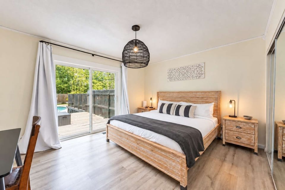 Wake up to natural light and a view of the pool from the master bedroom