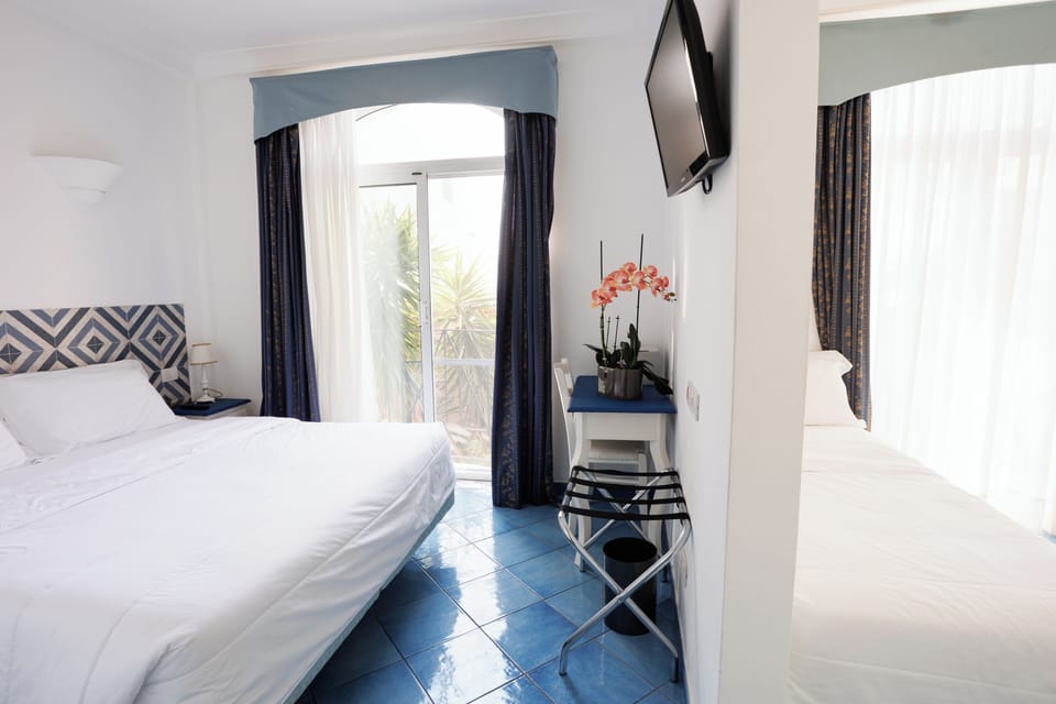 Frette Italian sheets, premium bedding, down comforters, minibar