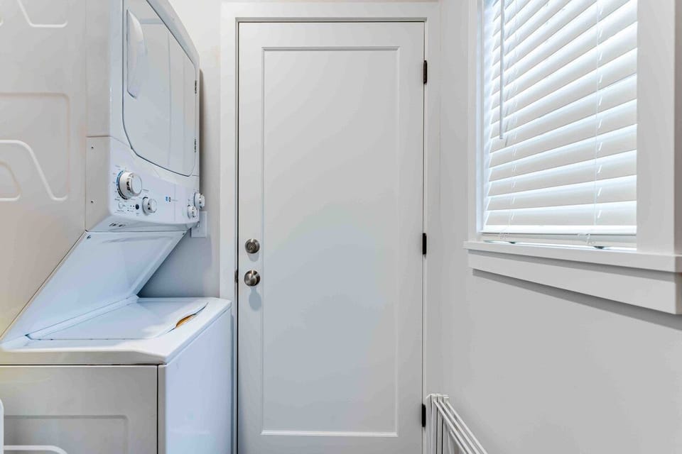 Laundry room- detergent, dryer sheets, and cleaning supplies provided.