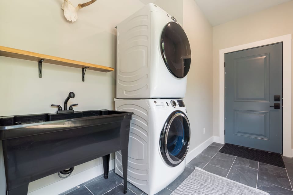 Your dedicated laundry space makes longer stays effortless, with a modern washer and dryer plus a utility sink for any extra needs.