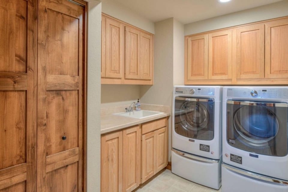 Full laundry room with commercial size washer and dryer