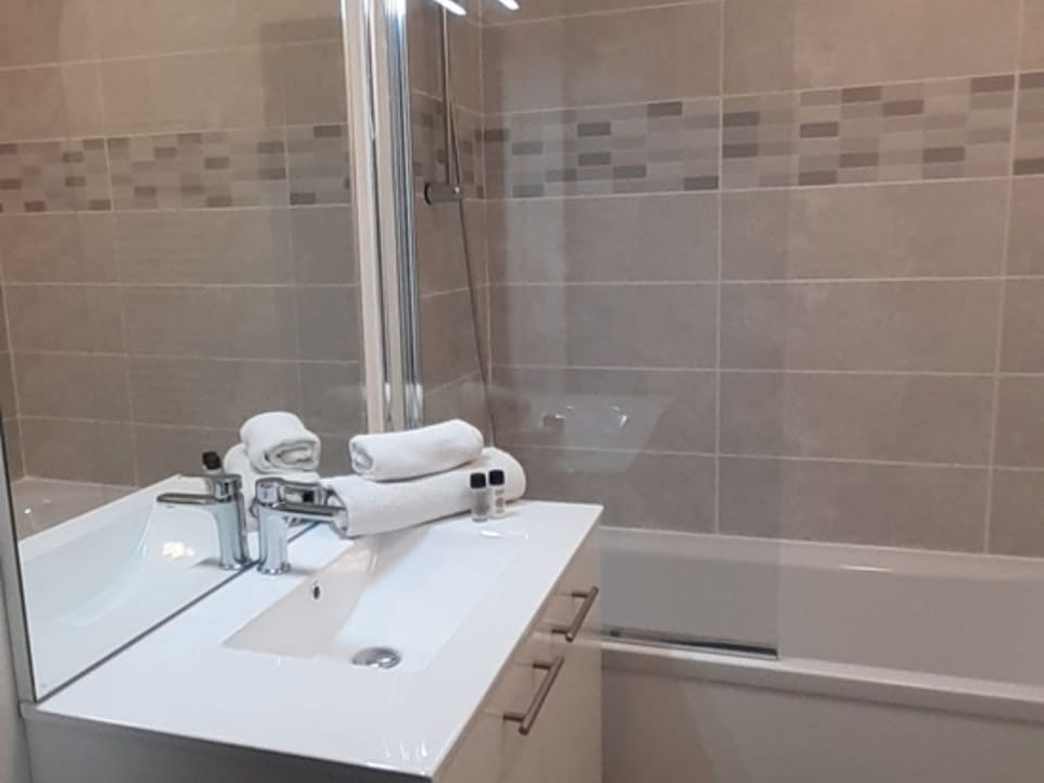 The bathroom includes a sink and toilet for your stay.