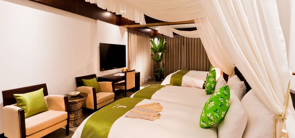 Family Quadruple Room | Minibar, in-room safe, desk, blackout drapes