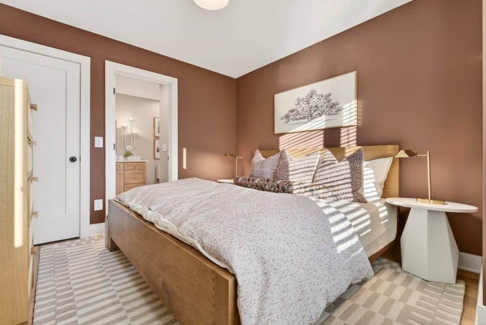 Bedroom 4 features a comfortable King bed, Smart TV, dresser, closet, and a private attached bathroom. Located on the 3rd floor.