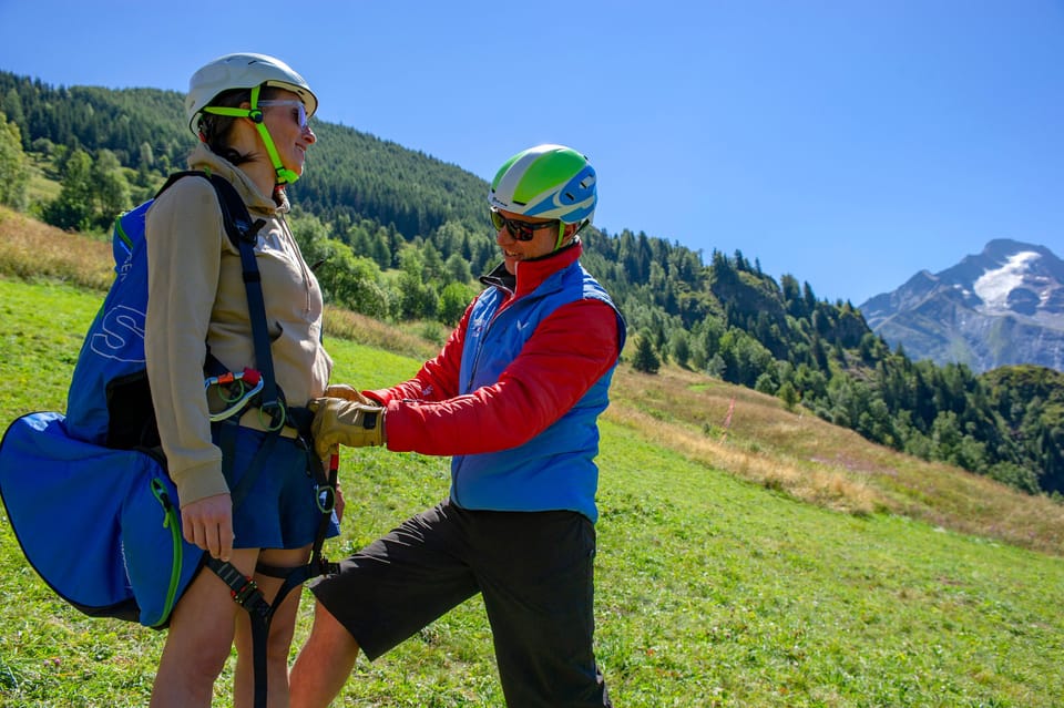 Getting ready for a tandem paragliding flight in the summer hills.