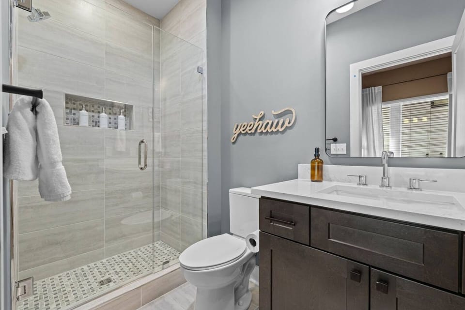 Private en-suite bathroom attached to Bedroom 1, featuring a spacious walk-in shower.