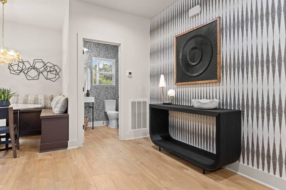 Bright and inviting living room, featuring a comfortable sofa bed and a Smart TV with access to all your favorite streaming services.