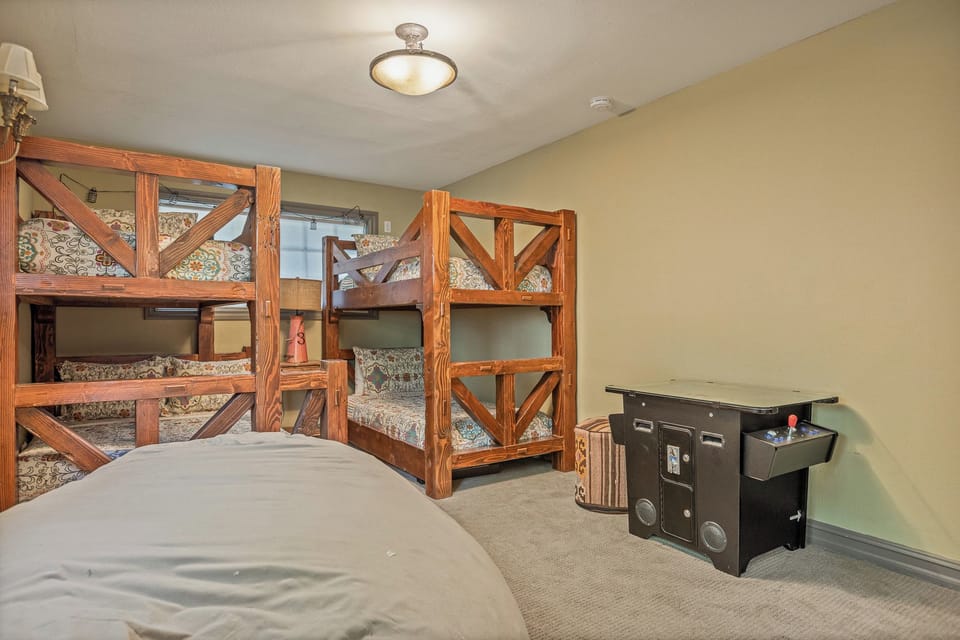 Family-friendly bunk room with arcade game and plenty of sleeping space