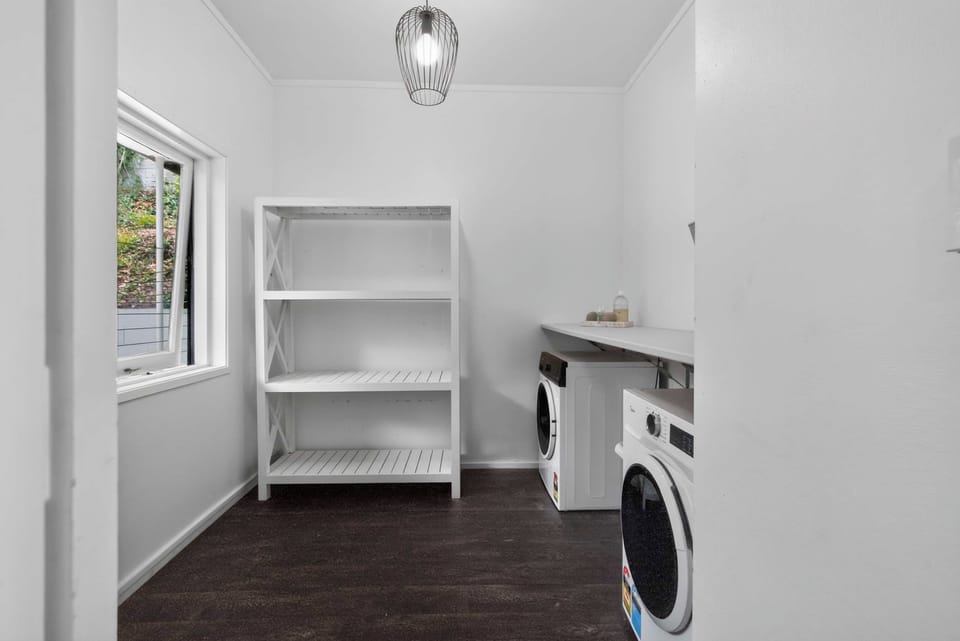 The laundry has a washer and dryer plus shelving for your gear.