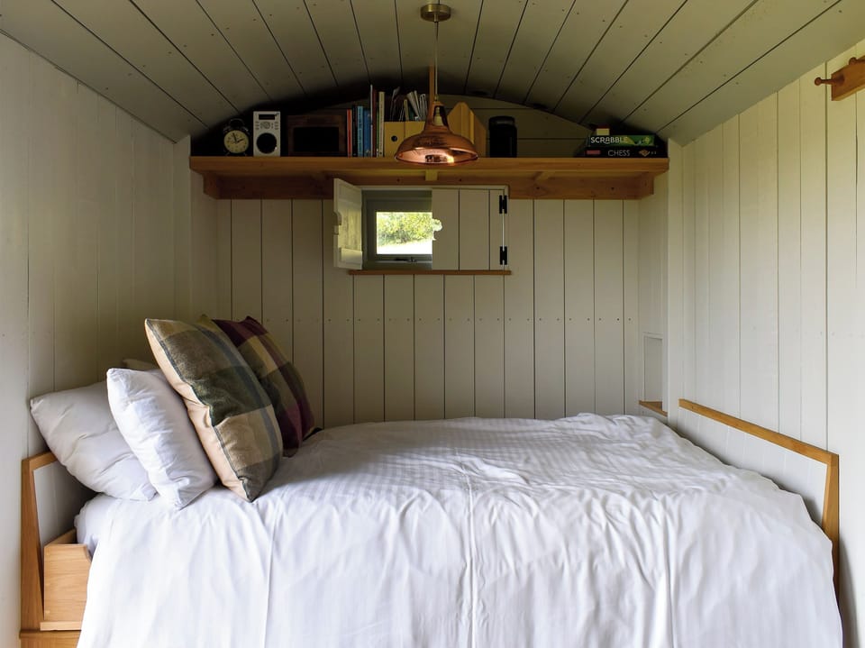 Comfortable dining and bedroom area | Jacob Hut, Romney Hut - Tilbury Farm, West Bagborough, near Taunton