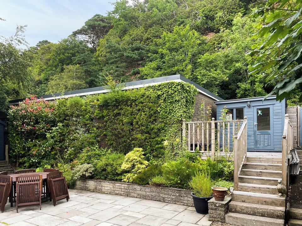Back garden with patio and upper decking and summer house | Arran View, Wemyss Bay