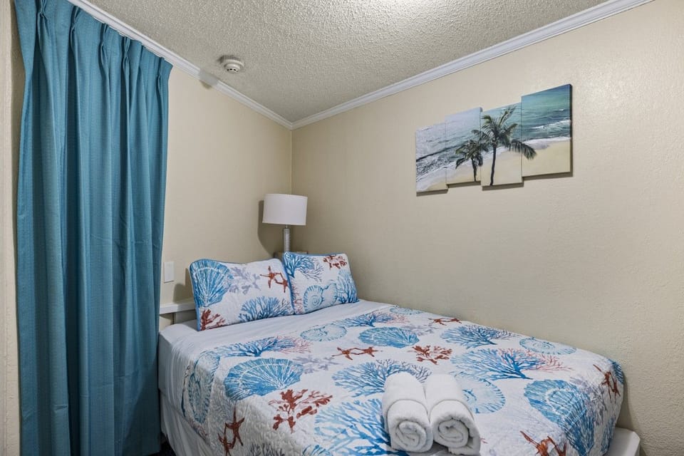 This bedroom has a queen-sized bed