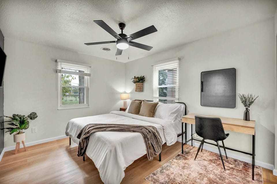 Unwind in a king bedroom with a dedicated workspace for work or travel planning.
