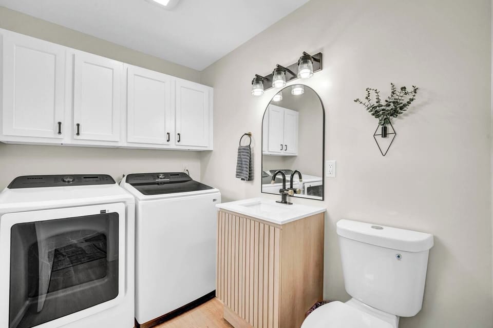 Laundry and a main-level half bathroom add everyday convenience.
