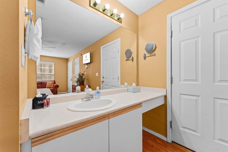 The first ensuite features a large single vanity & separate shower/tub combo​