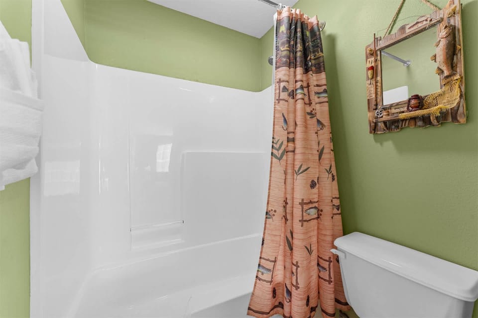 The first ensuite features a large single vanity & separate shower/tub combo​