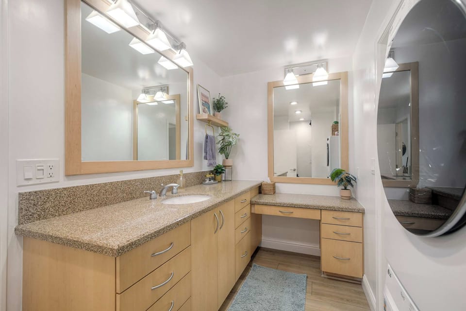 Refresh in the full bathroom with a walk-in shower and stacked washer and dryer