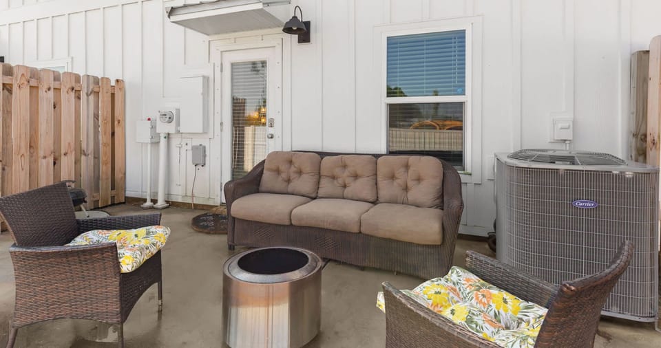 Sip morning coffee or an evening cocktail on the back patio​