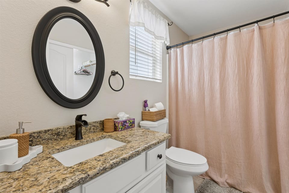 A spacious ensuite with an oversized tub for a leisurely soak.