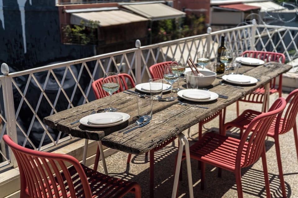 Terrace dinner set among the rooftops.