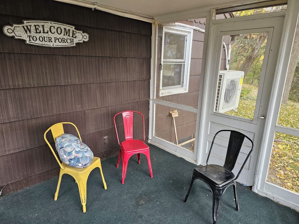 Three season porch off of living room with access to backyard